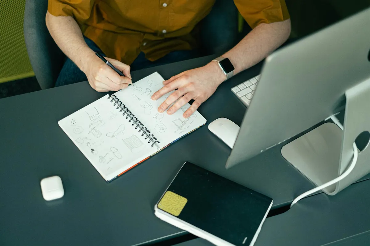 An illustrator's workspace with sketchbook and tablet